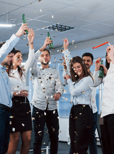 that-s-how-success-looks-like-photo-young-team-classical-clothes-celebrating-success-while-holding-drinks-modern-good-lighted-office